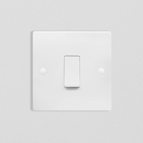 Raised plate switches and sockets
